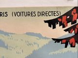 a poster with a picture of a town in the background