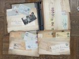 many old letters and envelopes sitting on the floor