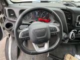 dashboard view of a car with a steering wheel and dashboard controls