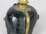 a black and gold vase with a gold top