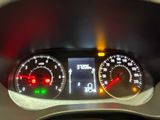 a close up of a speedometer on a car ' s dashboard