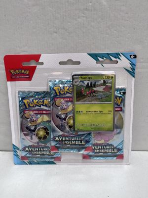 a close up of a box of pokemon cards on a white surface