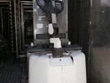 a machine that is sitting on a pallet in a warehouse