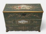 a green chest with a painting on it