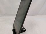 a tablet that is sitting on a stand on a table