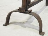 a close up of a metal table with a wooden top