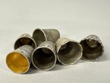 five silver cups sitting on top of each other