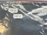 a plastic bag with a sticker on it sitting on a table