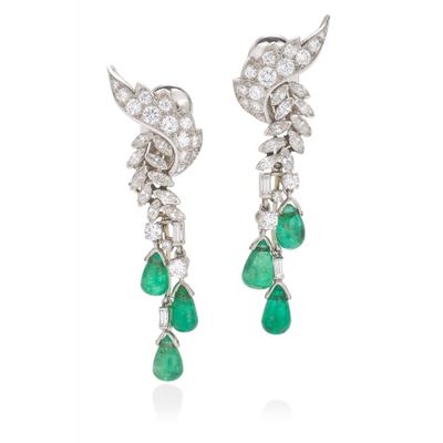 a pair of emerald and diamond earrings
