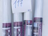five rolls of clear plastic with a price tag on them