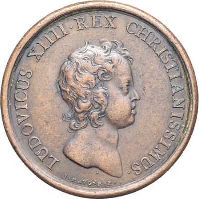 an old coin with a portrait of a woman on it
