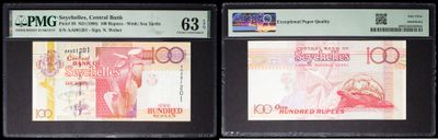 three different types of currency are on display in a display case