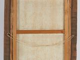an old picture of a picture frame hanging on a wall