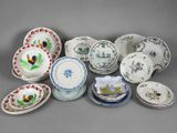 an assortment of porcelain plates and bowls with birds and flowers on them