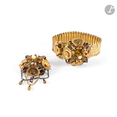an image of a gold bracelet and a ring with red stones