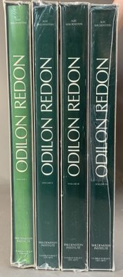 three books are stacked on top of each other on a shelf
