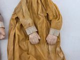 two dolls that are sitting next to each other on a table