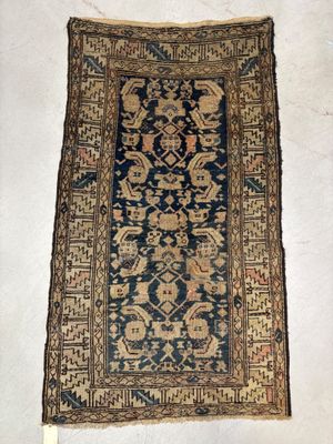 a close up of a rug on a white surface