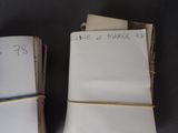 two pages of paper with writing on them on a table