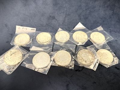six bags of cookies sitting on top of a table covered in plastic