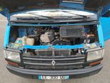 a blue truck with its hood open on the street