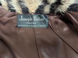 the jacket is brown and black with a leopard print on it