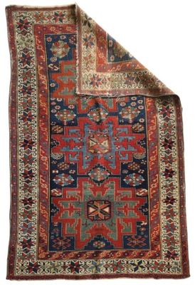 a red and blue rug on a white background
