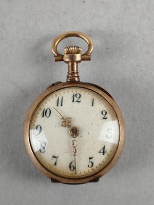 a gold pocket watch with a chain hanging from it