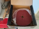 a box with a red disc in it sitting on the floor