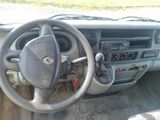 dashboard of a car with a steering wheel and dashboard controls
