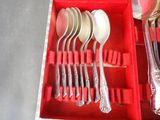 silverware in a red box with spoons and spoons in it