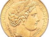 Gros plan sur une pièce d'or ornée d'une tête de femme