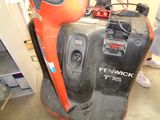 a red and black blow dryer sitting on top of a table