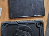 a cell phone that is sitting on a table next to a charger