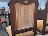 two chairs that are sitting in a room together