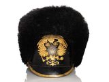 a black hat with a gold emblem on it