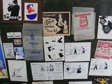 many different posters on the wall of a room