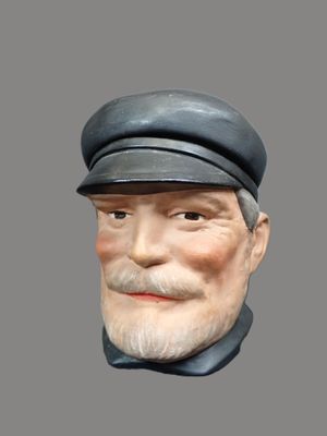 un buste d'homme coiffé d'un chapeau