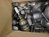 a cardboard box filled with many different types of pots and pans