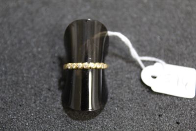 an image of a ring on a table with a price tag