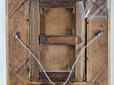 a picture of an old wooden easel with wires attached to it