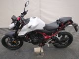 a picture of a white and red motorcycle parked on a checkered floor