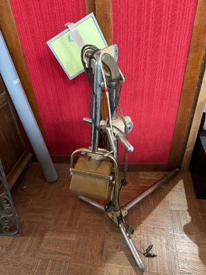 a bike that is sitting on a tripod in a room