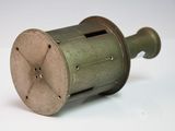 a small metal object that is on a white surface
