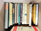 many books that are in a box on the shelf