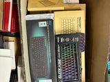 a cardboard box filled with computer equipment and other items