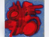 un carreau rouge et bleu orné d'un cœur rouge