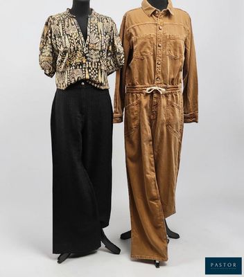 two mannequins are standing next to each other in front of a white background