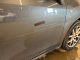 a close up of a car ' s door handle on the side of the car