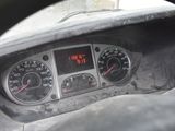 a close up of a car dashboard with a clock on it